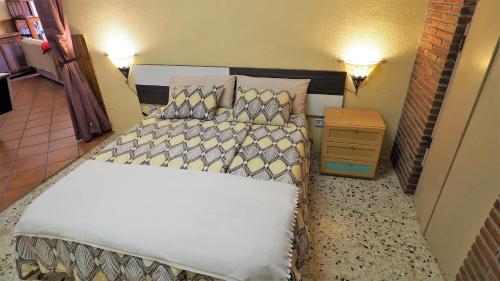 Katil atau katil-katil dalam bilik di Villa Carolina