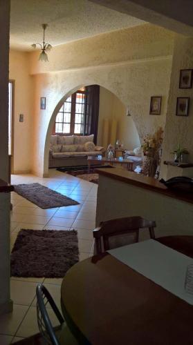 a living room with a couch and a table at Amazing View Home in Plataria