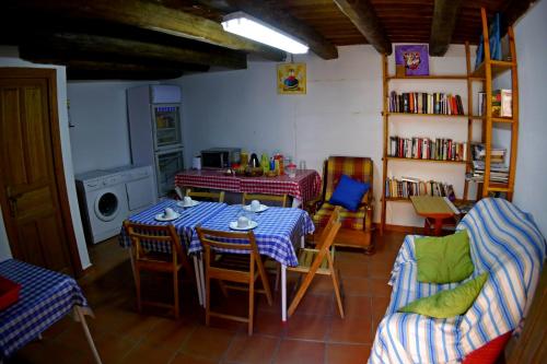 a kitchen with a table and chairs in a room at Albergue Restaurante de Artieda in Artieda