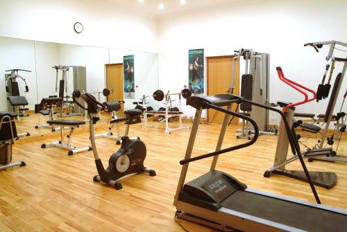a gym with several treadmills and exercise bikes at Lahami Bay Beach Resort in Abū Ghuşūn