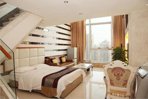a bedroom with a staircase and a bed in a room at Guangzhou Ba Dun Hotel - Beijing Road in Guangzhou