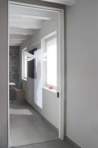 an open door in a room with a window at TiAMo Modern Design Guest House in Ronchi dei Legionari