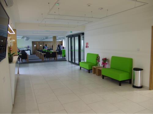 Χώρος καθιστικού στο Hotel Uniejów