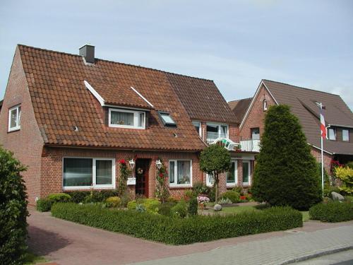 a brick house with a brown roof at Haus Waldenfels in Sankt Peter-Ording