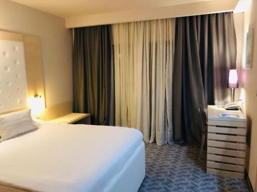 Кровать или кровати в номере Hotel Plaza