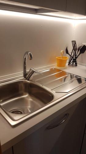a stainless steel kitchen sink in a kitchen at Casa del Sole in Letojanni