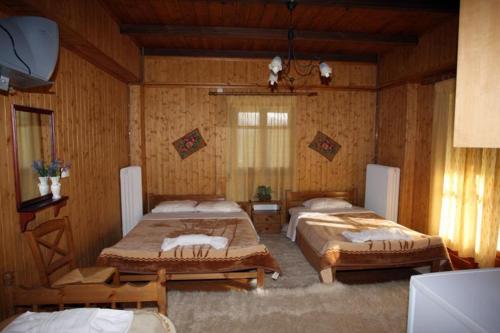 Кровать или кровати в номере Athamania Artas