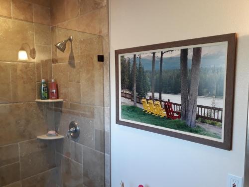 a bathroom with a shower with a picture of chairs at Comfortable Luxury Studio in Los Angeles