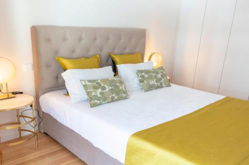 Cama ou camas em um quarto em Graça Apartment