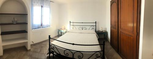 A bed or beds in a room at Villa Trullo di Angela