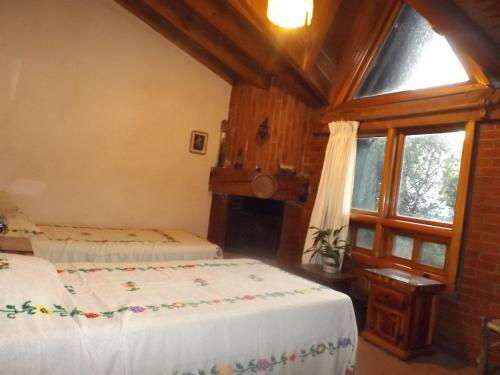 Ένα ή περισσότερα κρεβάτια σε δωμάτιο στο Casa Paanoramica