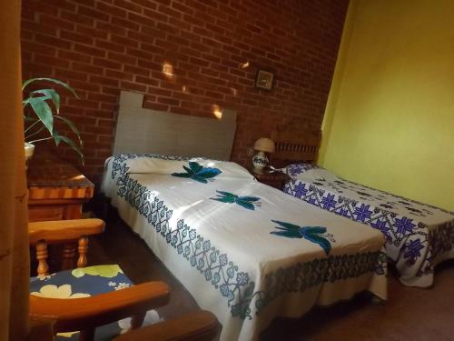 Ένα ή περισσότερα κρεβάτια σε δωμάτιο στο Casa Paanoramica