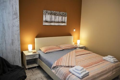 Ένα ή περισσότερα κρεβάτια σε δωμάτιο στο Guest Apartment Balkan