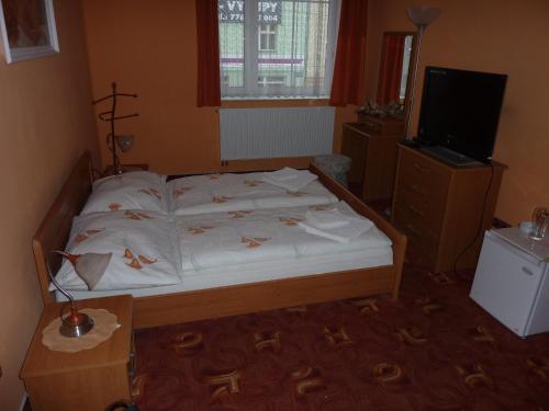 Postel nebo postele na pokoji v ubytování Hotel Paradise