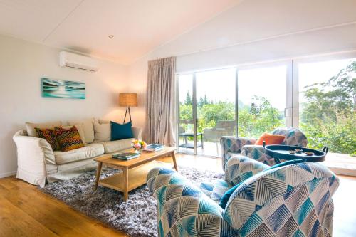 Ein Sitzbereich in der Unterkunft Treghan Luxury Lodge