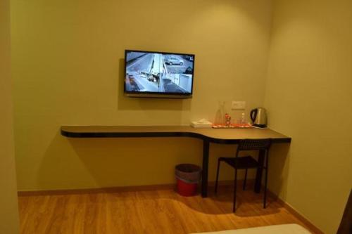 TV a/nebo společenská místnost v ubytování U Design Hotel Mentakab