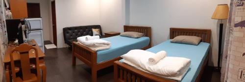 Postel nebo postele na pokoji v ubytování Green Mango Resort