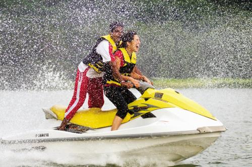 two men on a jet ski in the water at Aamby Valley City in Lonavala