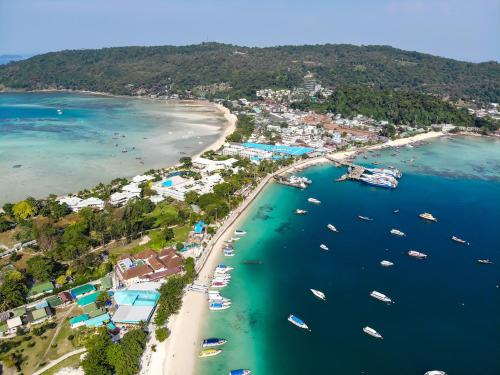 an aerial view of a beach with boats in the water at Phi Phi CoCo Beach Resort in Phi Phi Don