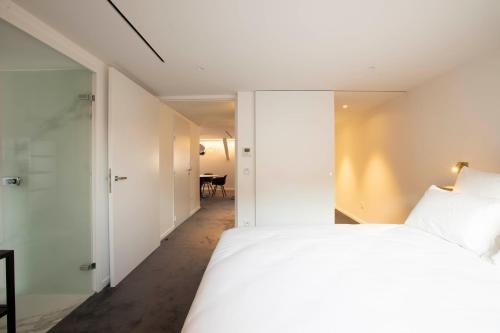 Katil atau katil-katil dalam bilik di BORD EAU Guest House