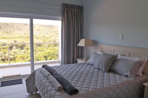 Giường trong phòng chung tại Myoli Holiday Apartments