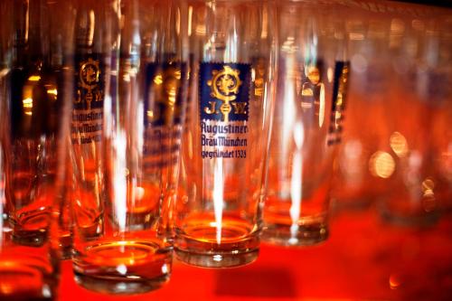 a row of wine glasses sitting on a table at Euro Youth Hotel & Krone in Bad Gastein