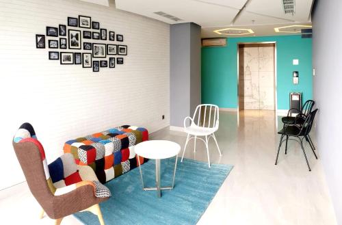 a room with chairs and a couch and a table at BW inn Belitung in Tanjungpandan