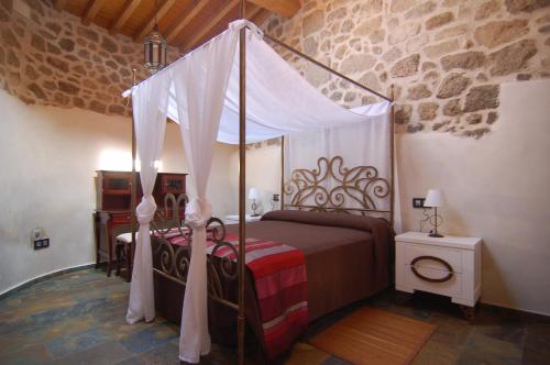 Postel nebo postele na pokoji v ubytování Apartamentos A Fala en Trevejo y San Martin de Trevejo, Sierra de Gata