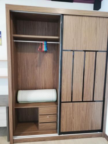 a wooden closet with a mattress in it at Green Haven Homestay in Pasir Gudang