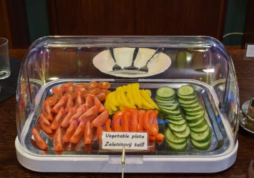 a plastic container filled with different types of vegetables at Hotel La Rosa in Frýdek-Místek
