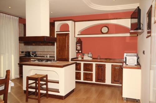 a kitchen with a stove and a counter top at Magnolia in Savignano sul Rubicone