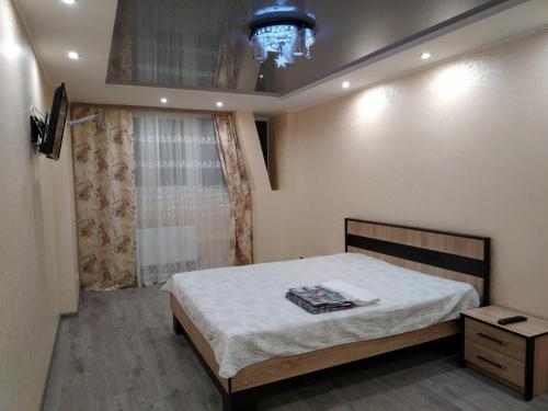 Кровать или кровати в номере Апартаменты новострой улица Замостянская 34 А