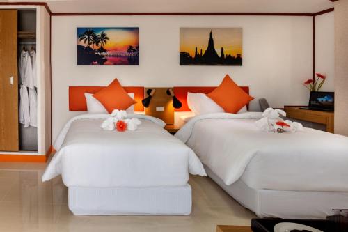 Gulta vai gultas numurā naktsmītnē 7 Days Premium Hotel Bangna - Suvarnabhumi Airport