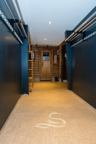 a hallway with a bike painted on the floor at Wellnesshotel Spabron in Wachtum