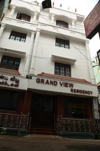 a large white building with a sign on it at Grand View Residency Chennai in Chennai