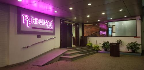 a building with a sign that reads rre recovery clinic at Regenta Place Bangalore, Cunningham Road in Bengaluru