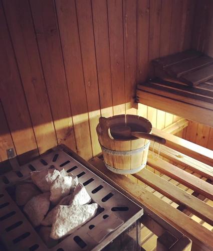 a corner of a room with a stove and a bucket at Hotel Terme Patria in Abano Terme