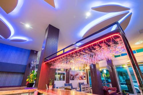 a restaurant with a chandelier hanging from the ceiling at Anchan Hotel & Spa in Hua Hin