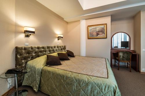 Cama o camas de una habitación en Neptun Hotel