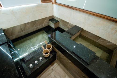 an overhead view of a pool of water in a room at ChunYang Homestay春陽一品居 in Renai