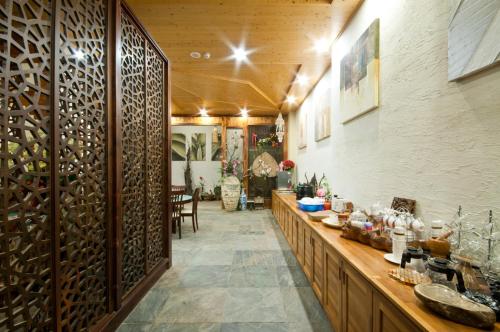 a tasting room with a bunch of wine bottles at ChunYang Homestay春陽一品居 in Renai