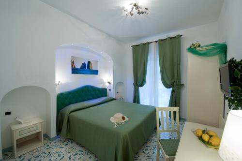 Postel nebo postele na pokoji v ubytování Hotel La Conchiglia