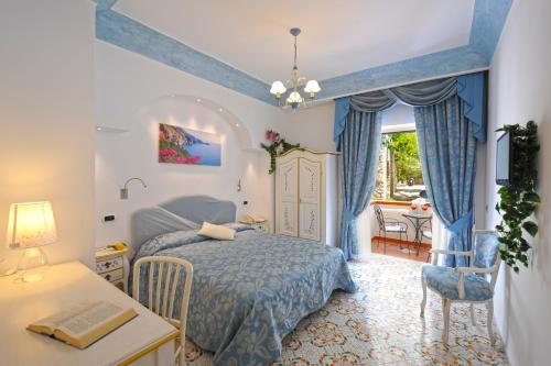 Postel nebo postele na pokoji v ubytování Hotel La Conchiglia