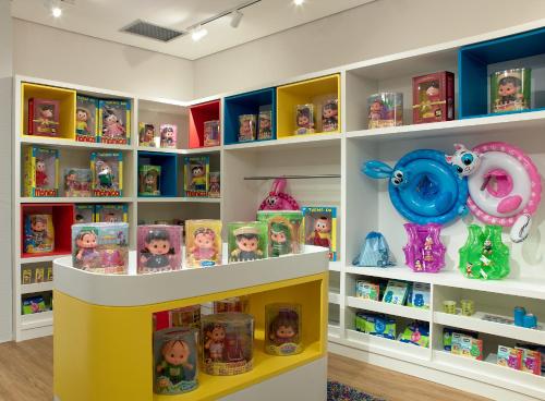 a toy store with shelves filled with toys at Bourbon Resort Atibaia in Atibaia