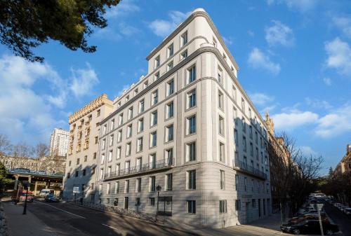 a white building on the side of a street at Plaza de España Skyline in Madrid