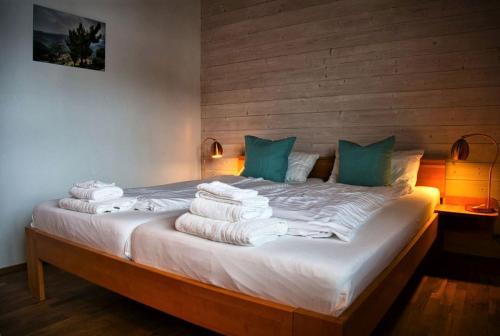 a bedroom with a bed with towels on it at Haus Dürr23 in Lauterbach