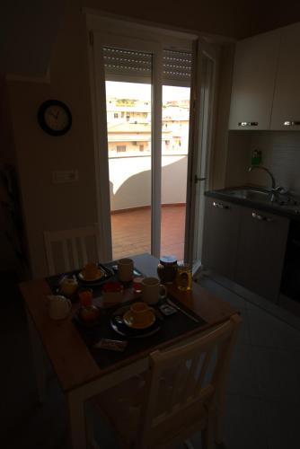 a kitchen with a table with dishes on it at Chalet sul mare in Catanzaro Lido