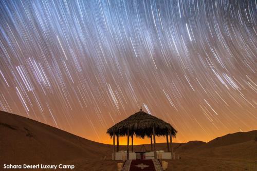 a view of the night sky with star trails at Sahara Desert Luxury Camp in Merzouga