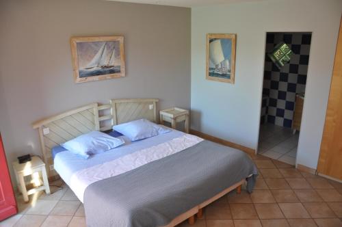 Postel nebo postele na pokoji v ubytování Chambre d'Hôtes de l'Estuaire