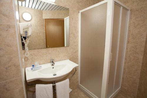 a bathroom with a sink and a shower at Hotel Esperia in Rho